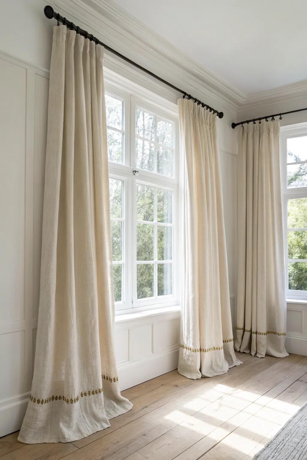 Hang linen drapes high and let them skim the floor—instant height, softness, and glow.