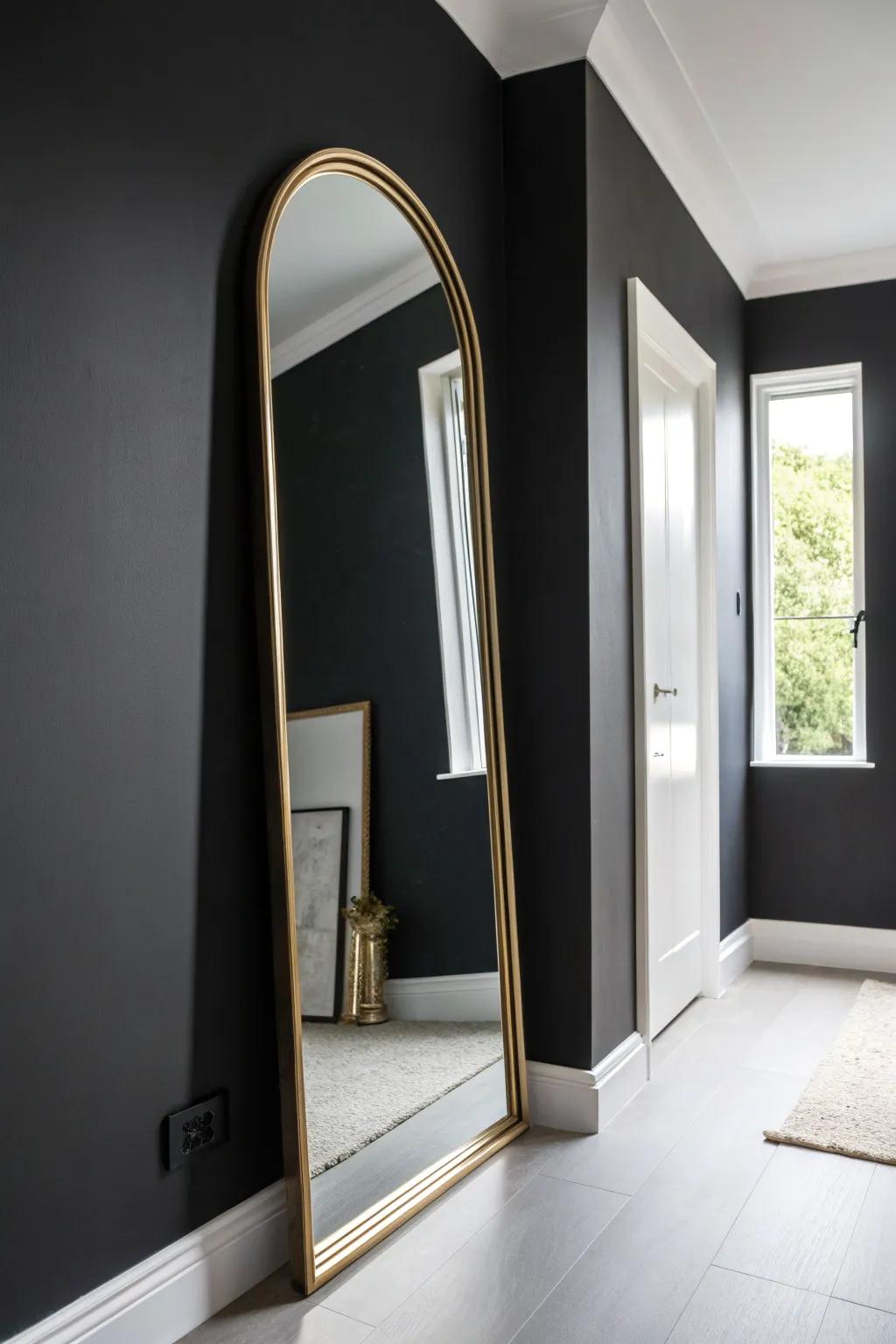 Matte black hallway walls + a warm brass mirror—instant polish that hides scuffs.