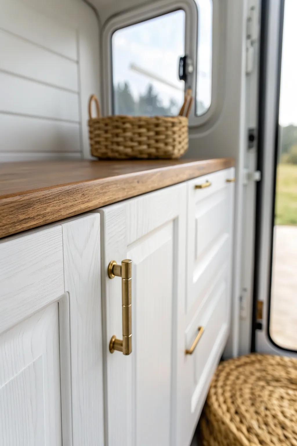 Bright white paint plus warm wood tones makes a small camper feel bigger, cleaner, and cozy.