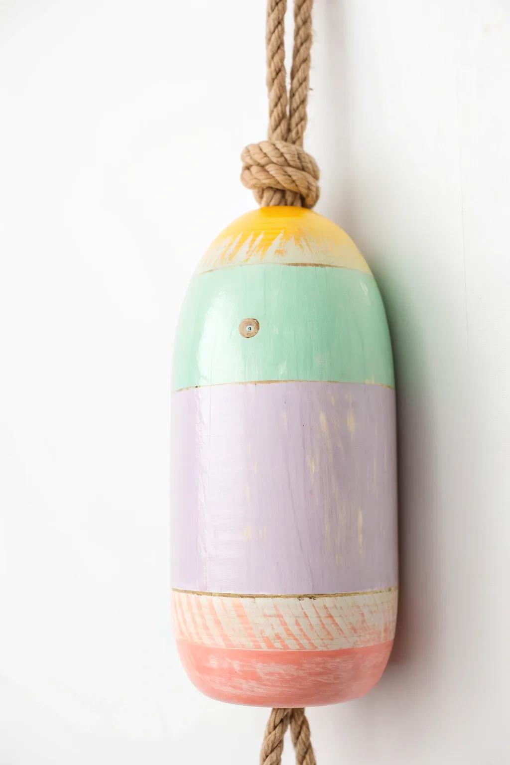 Elevate your space with a splash of color: Discover the art of painted buoys.