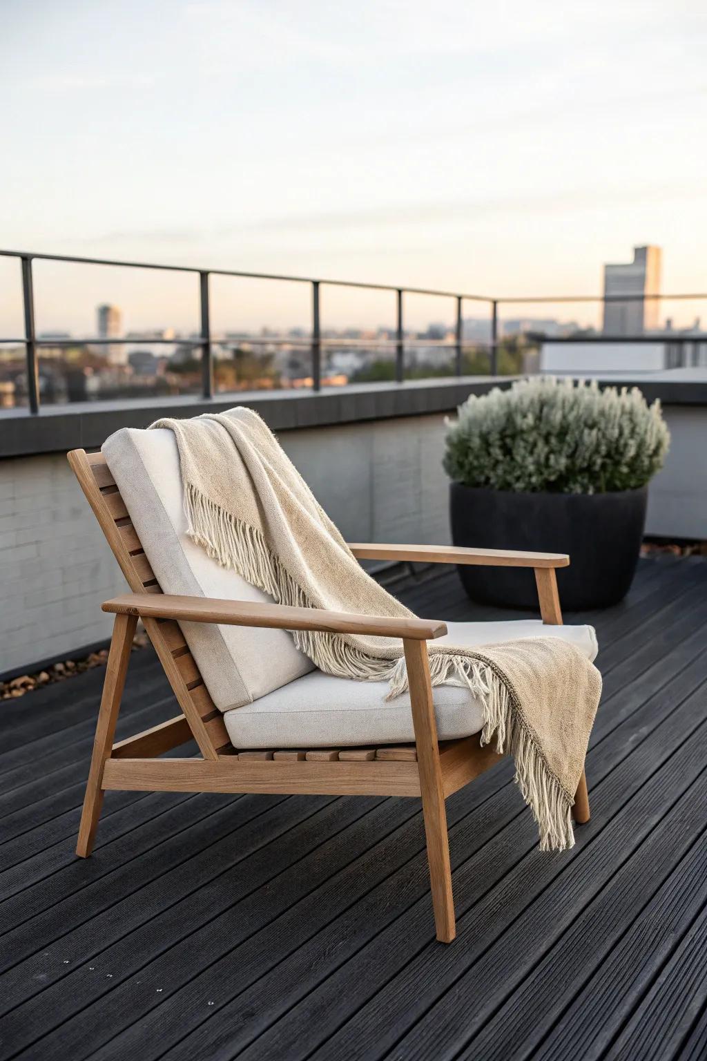 One hero piece turns a tiny rooftop deck into a calm lounge zone—no clutter, just intent.