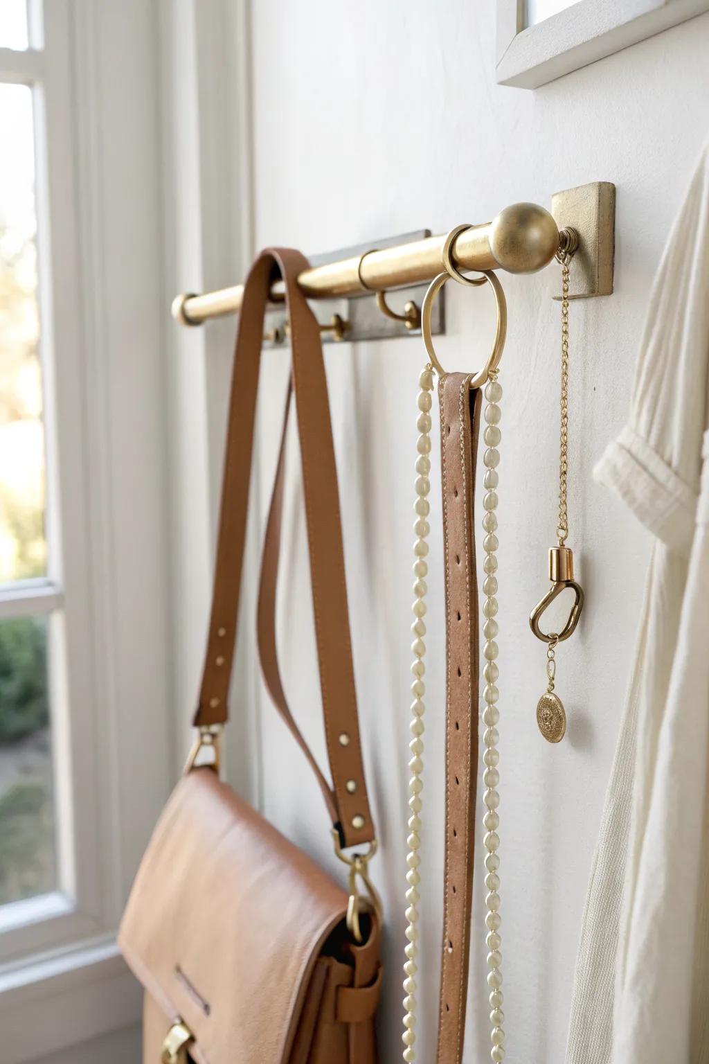 A sleek valet rod keeps belt, bag, and jewelry ready—perfect for tiny closets.