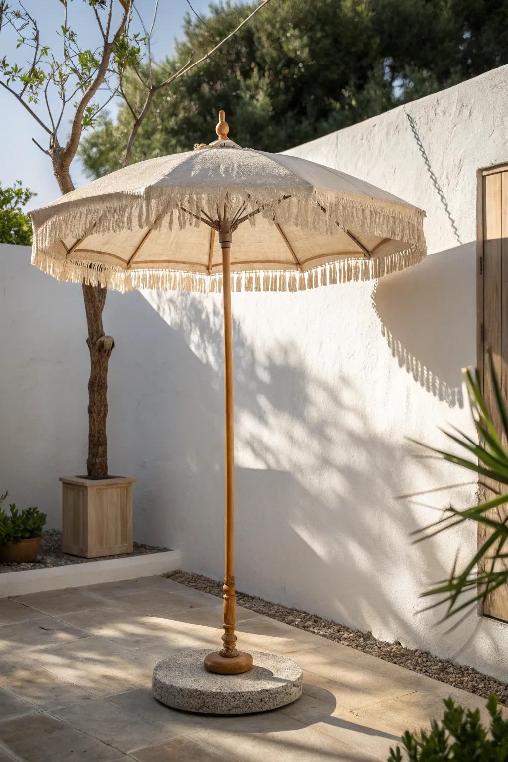 A slim linen parasol brings cool shade to tiny patios—no bulky footprint, just calm style.
