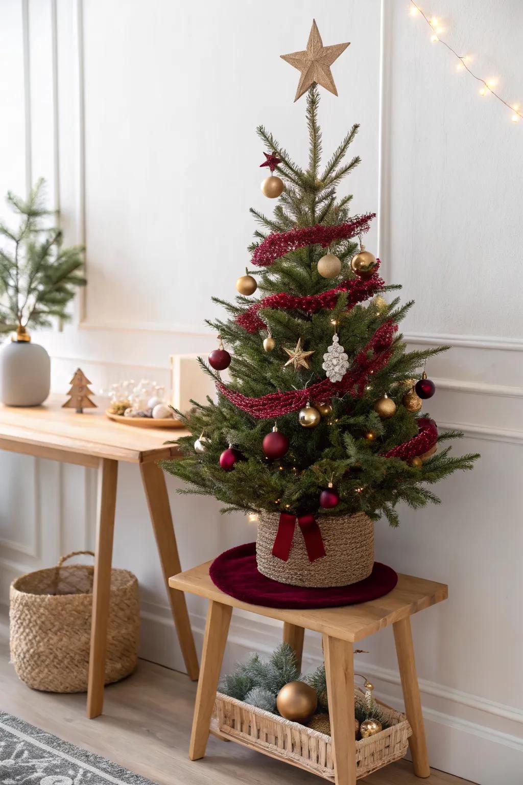 A 4ft tree on a console table—minimal accents, big impact for small-space holiday style.