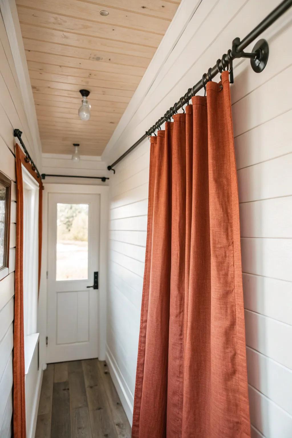 Ceiling-track linen curtain door: a swing-space saver that adds warm, minimalist boho style.