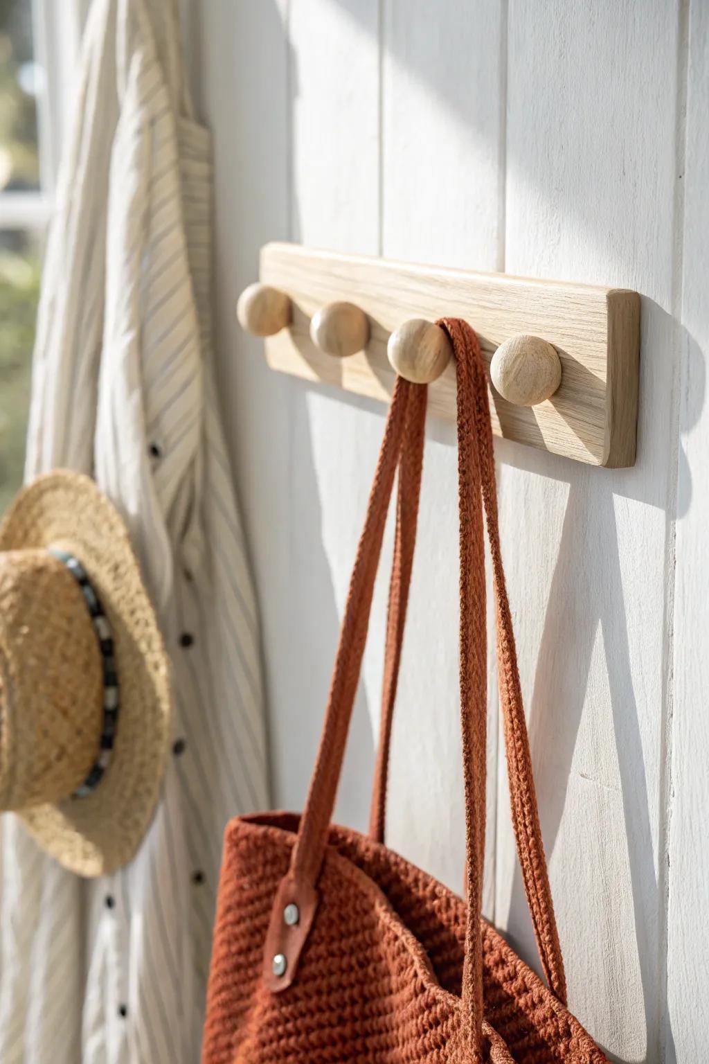 A simple peg rail keeps bags and outerwear tidy—perfect for a bedroom with no closet.