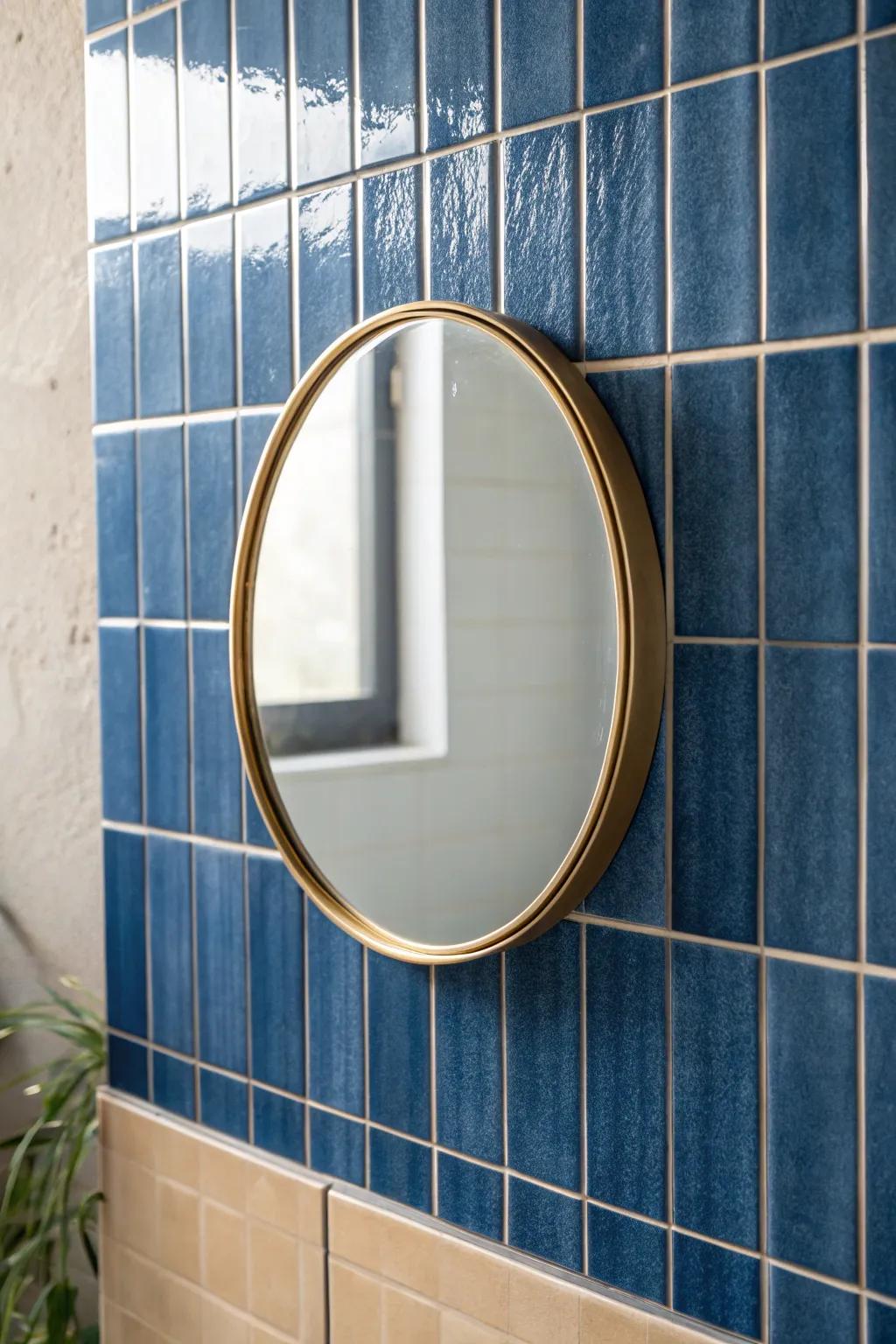 Kit Kat tiles behind a simple brass mirror create soft vertical texture—and a taller feel.