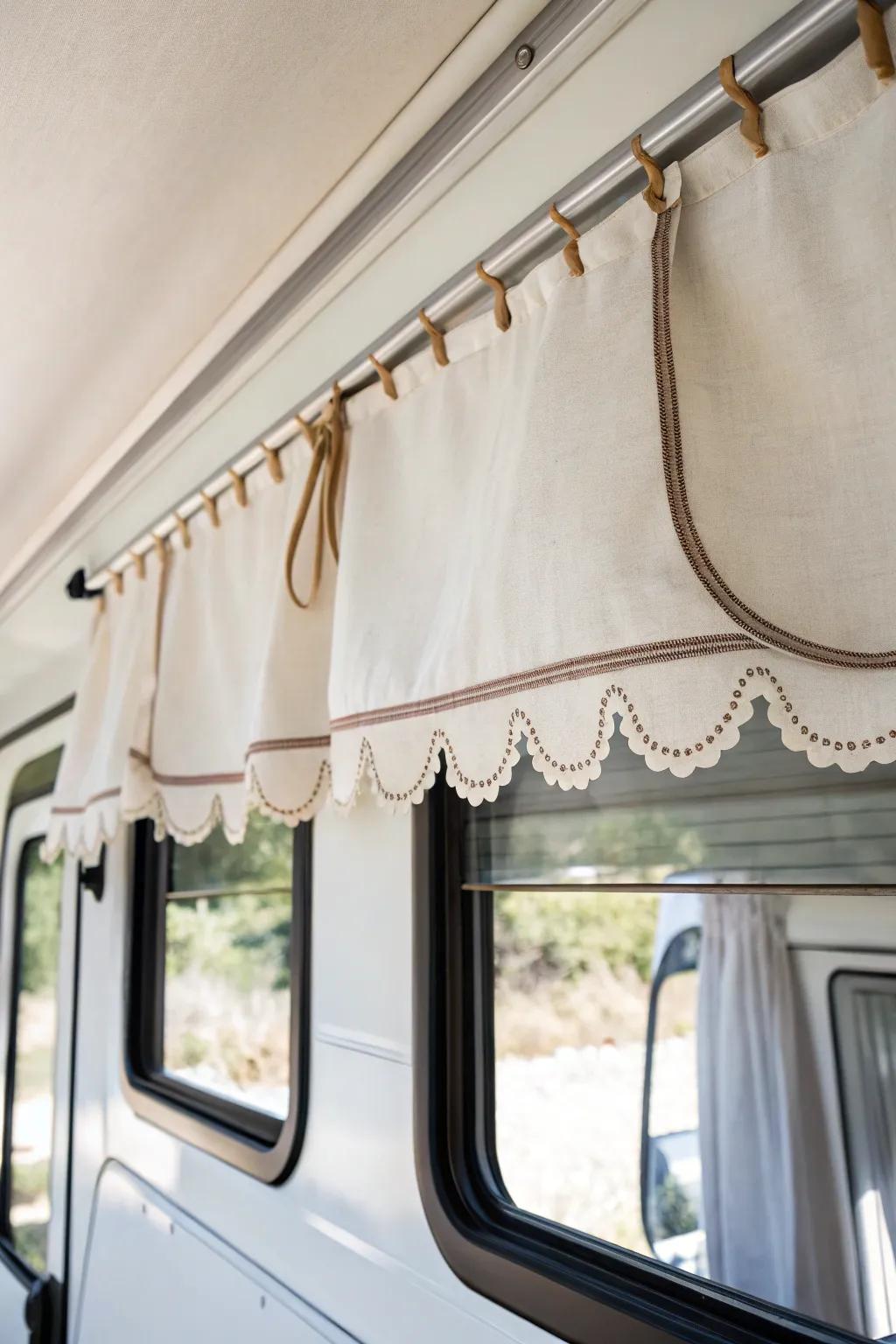 A sweet scalloped RV valance adds vintage softness and charm—without cluttering a small space.