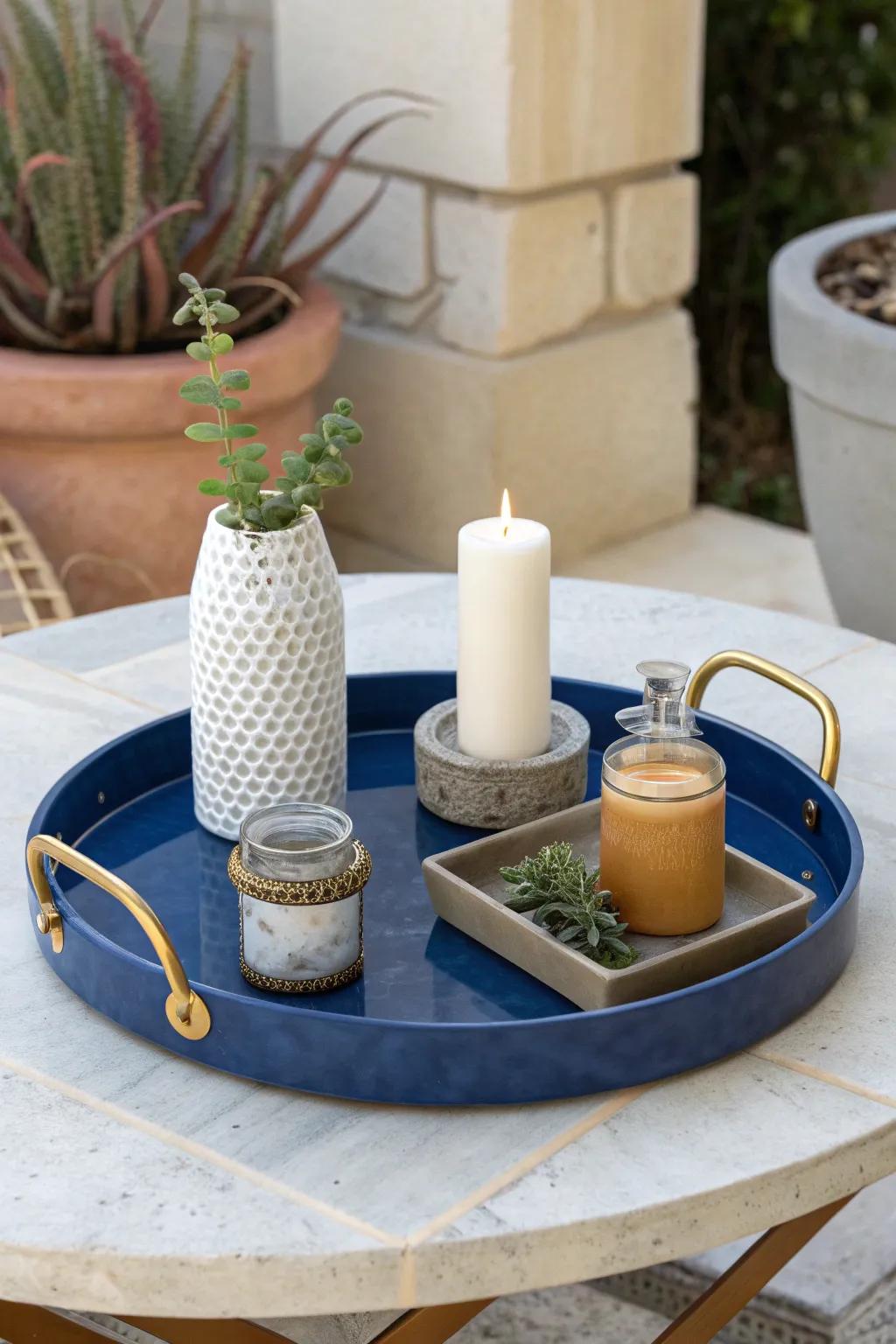 Keep a tiny boho patio calm: one chic tray holds candles, matches, and a mini vase.
