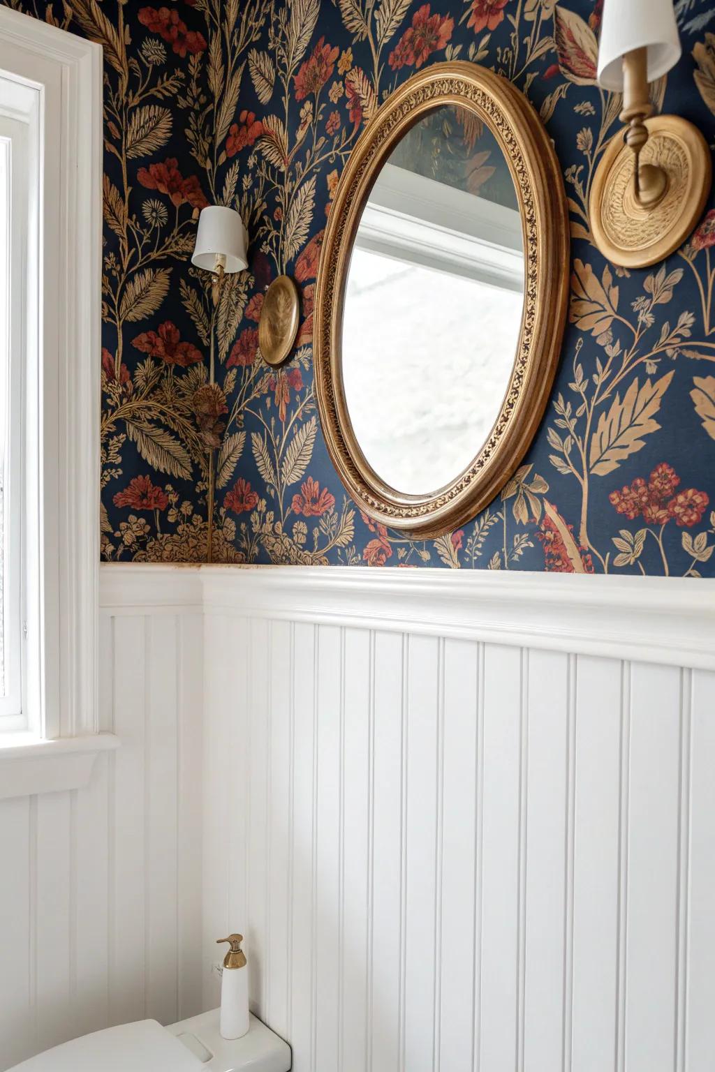 Patterned wallpaper above crisp wainscoting gives a tiny traditional bath instant depth.