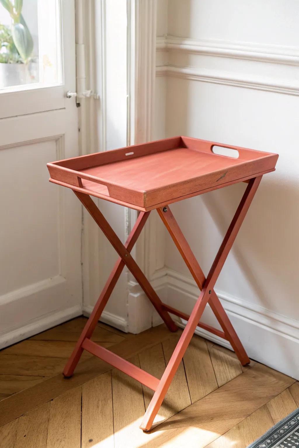 A solid-color paint refresh turns an old TV tray into chic, intentional small-space furniture.