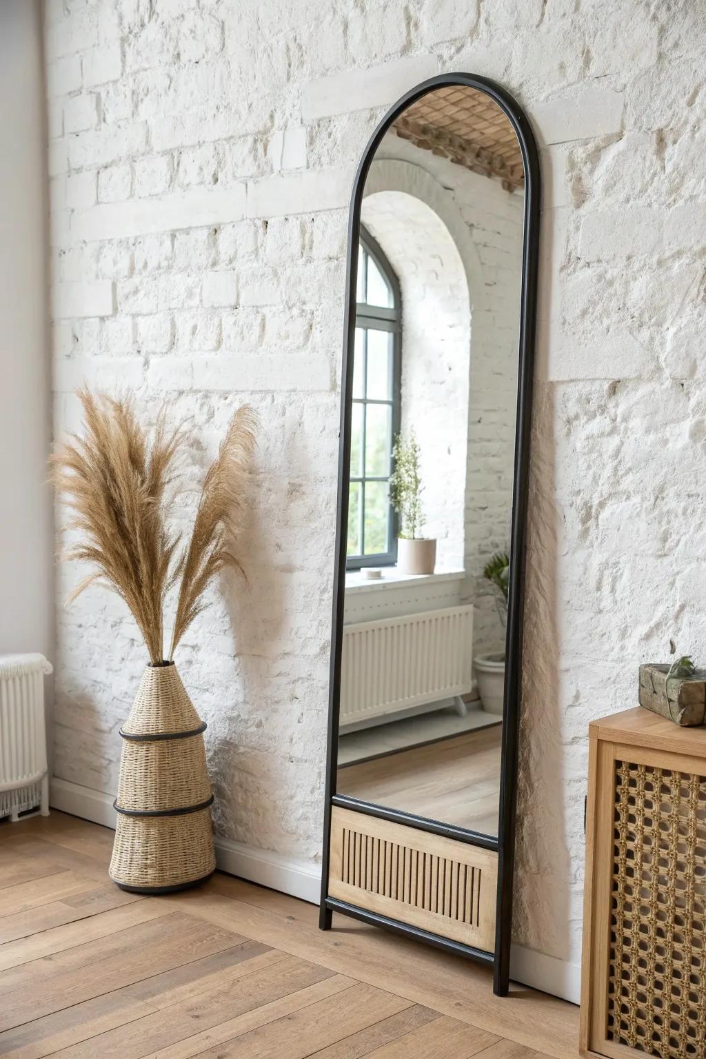 Mirror-front heater cover that bounces light and makes a small wall feel instantly bigger.