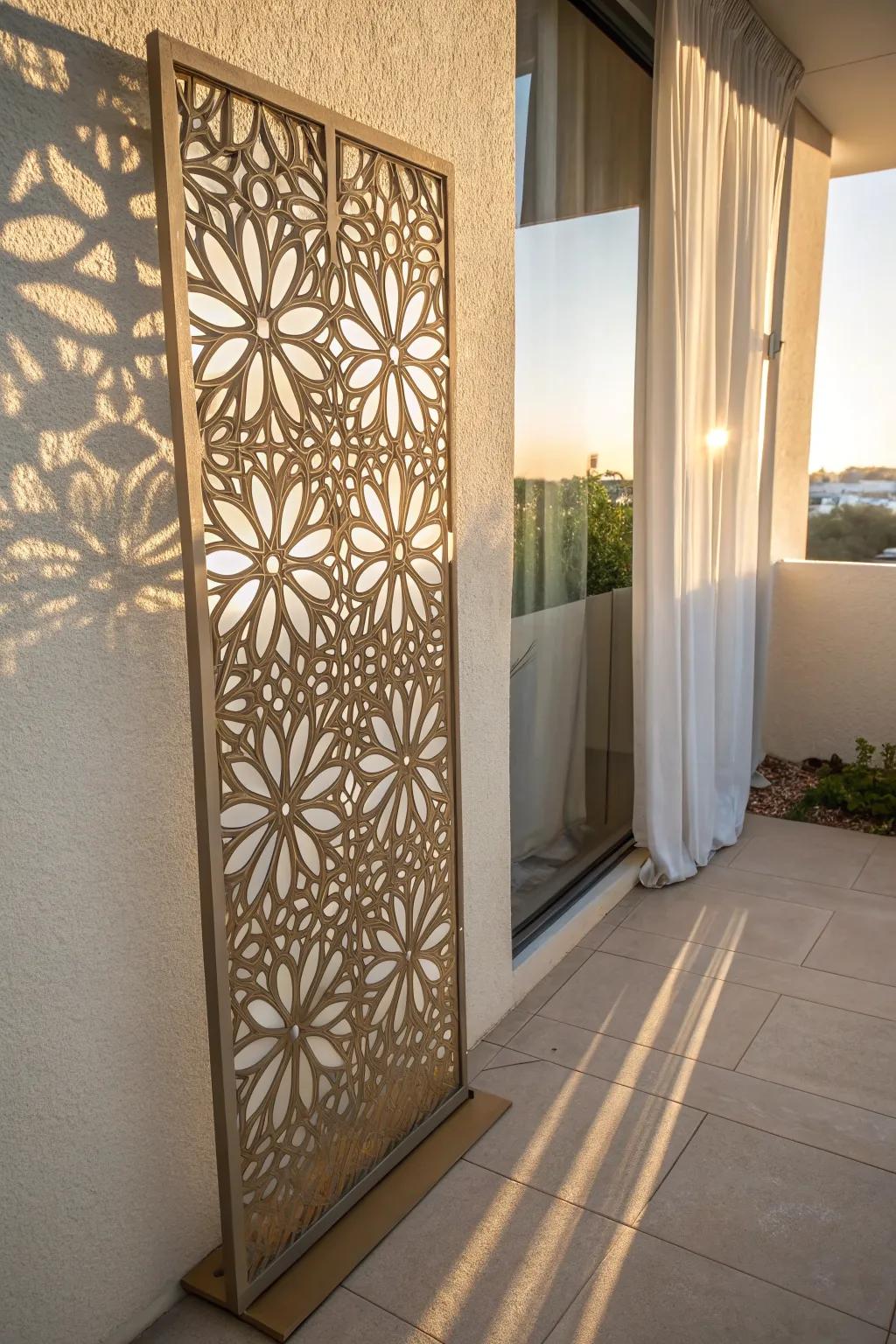 Laser-cut metal screen panel that filters light into dreamy shadow patterns for balcony privacy.