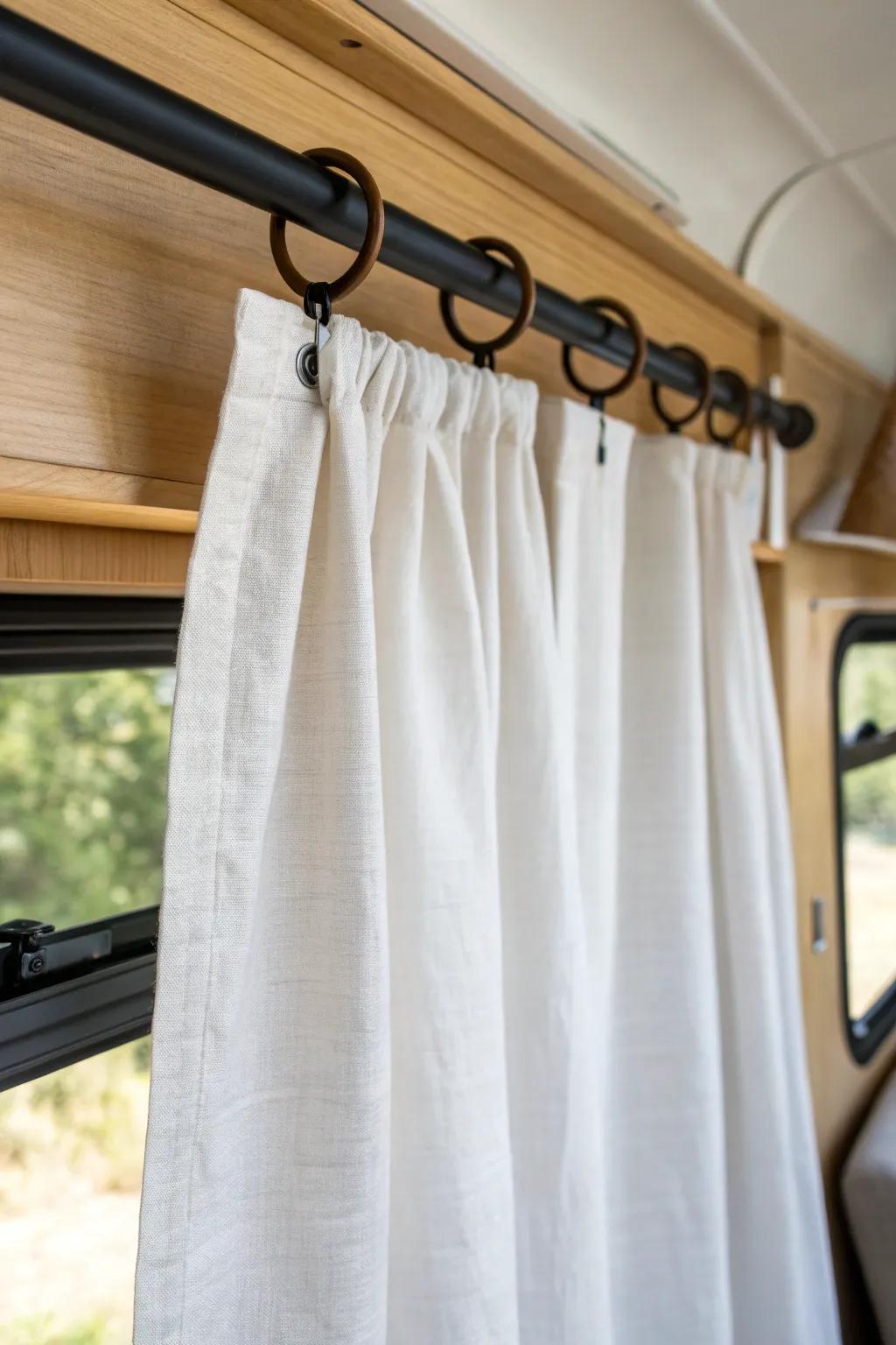 Budget camper curtains: a crisp bed sheet panel for an airy, minimalist look in minutes.