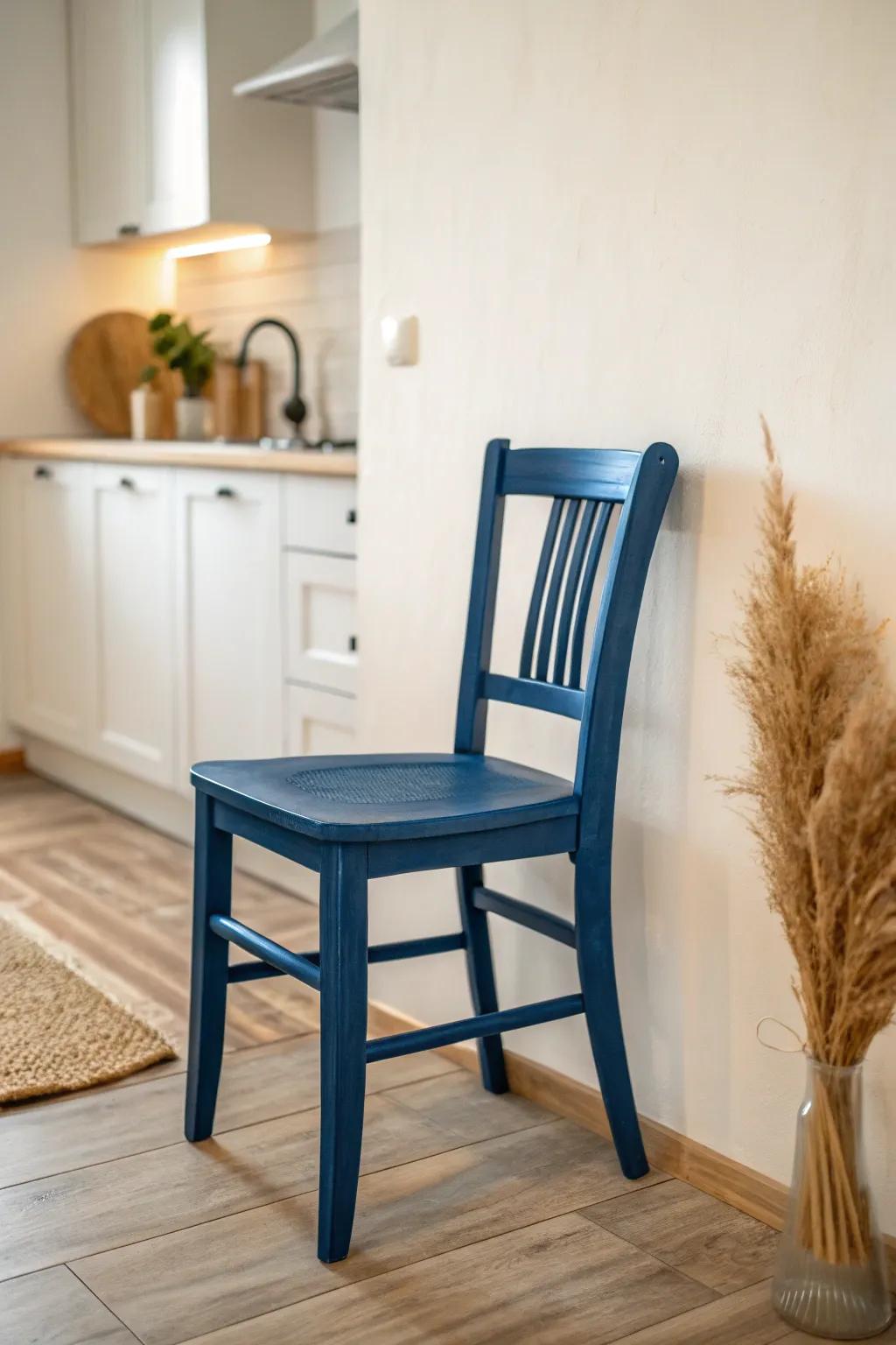 Light walls + one bold chair: energize a tiny break room instantly without making it feel busy.