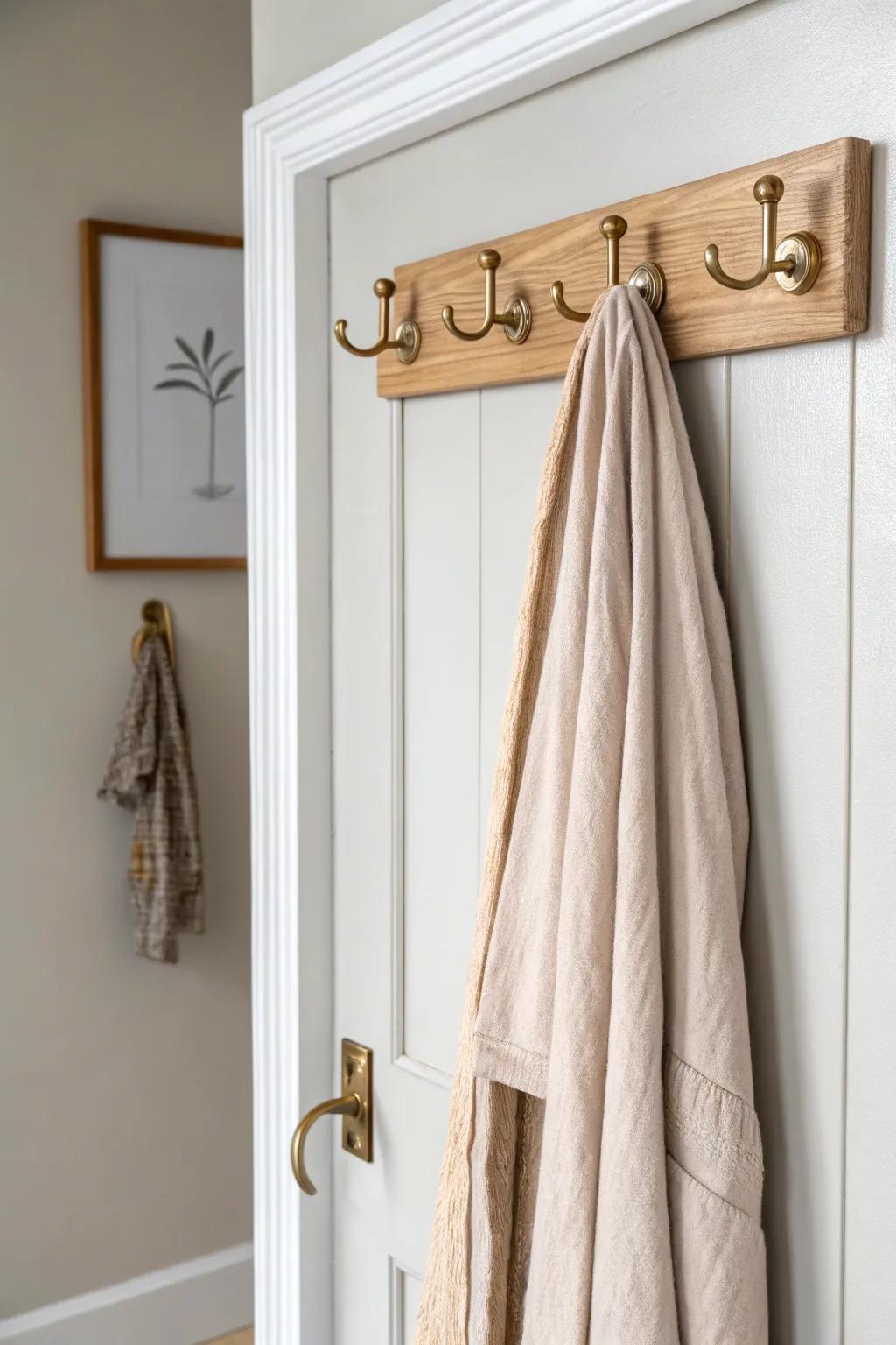 Turn the back of your door into hidden storage with a sleek over-the-door hook rail.