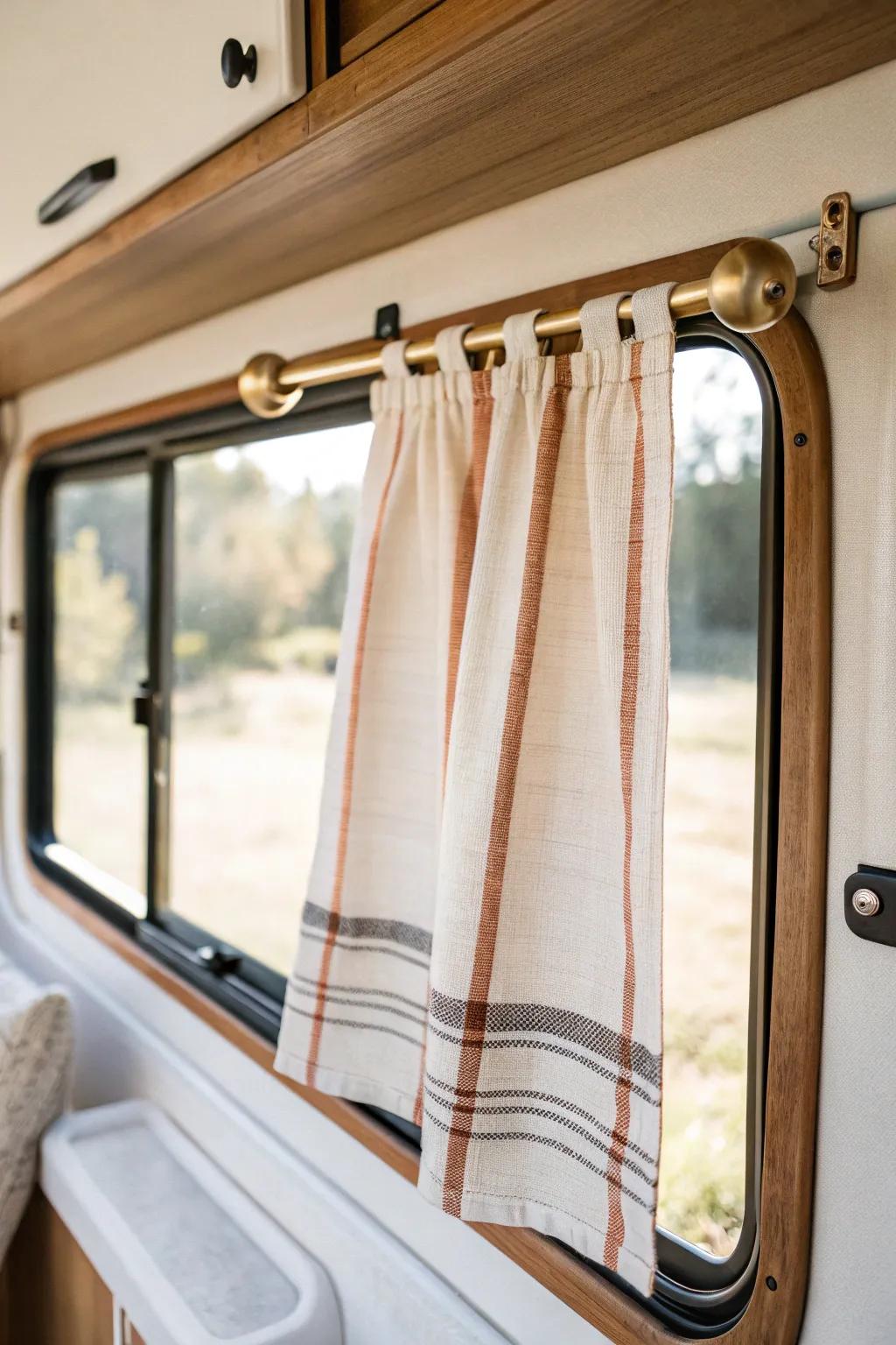 Camper-cute clip‑on curtain: a pretty dish towel adds charm and stays out of splashes.