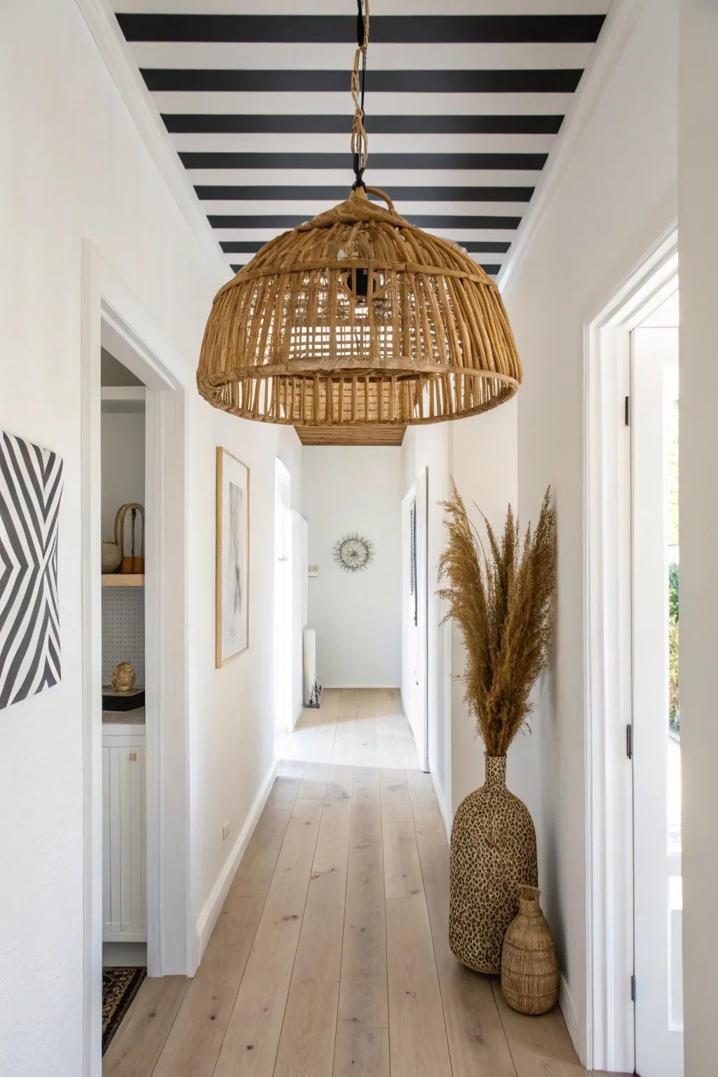 Bold striped ceiling paint + one handcrafted pendant light for a high-contrast, chic entry moment.