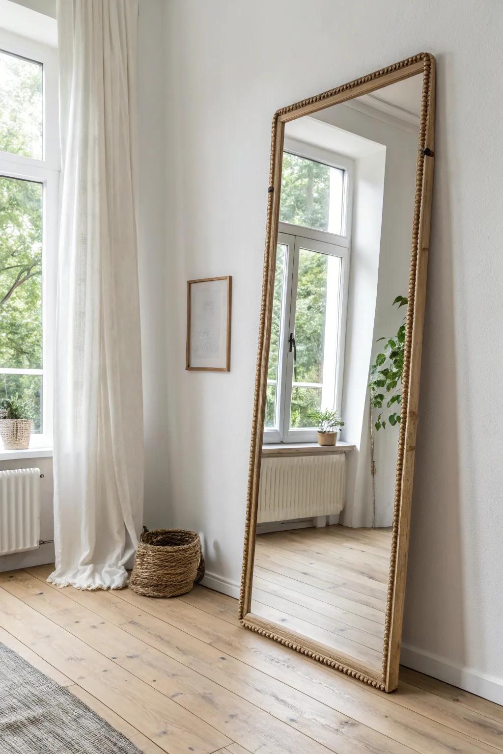 A wall-size mirror panel opposite a window doubles the light and adds instant depth—zero clutter.