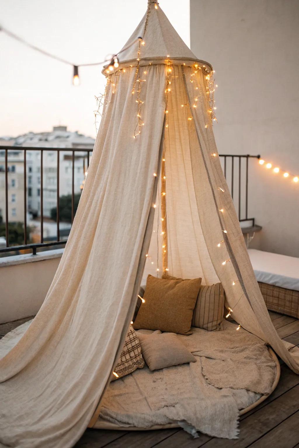 A draped linen canopy with twinkle lights turns a tiny balcony into a cozy, private retreat.