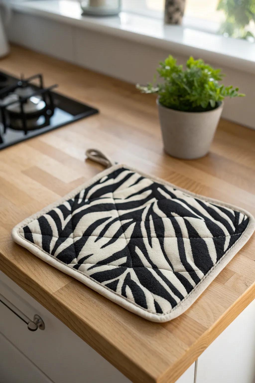 Add a touch of the wild to your kitchen with this chic zebra print pot holder, where style meets function!