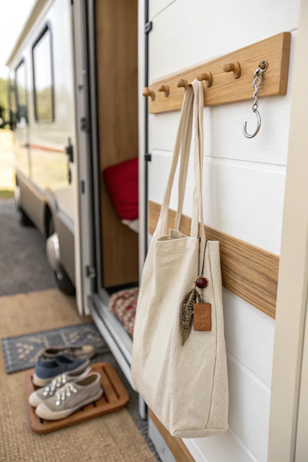 Mini mudroom magic: sleek RV entry hooks keep bags up and shoe mess neatly contained.