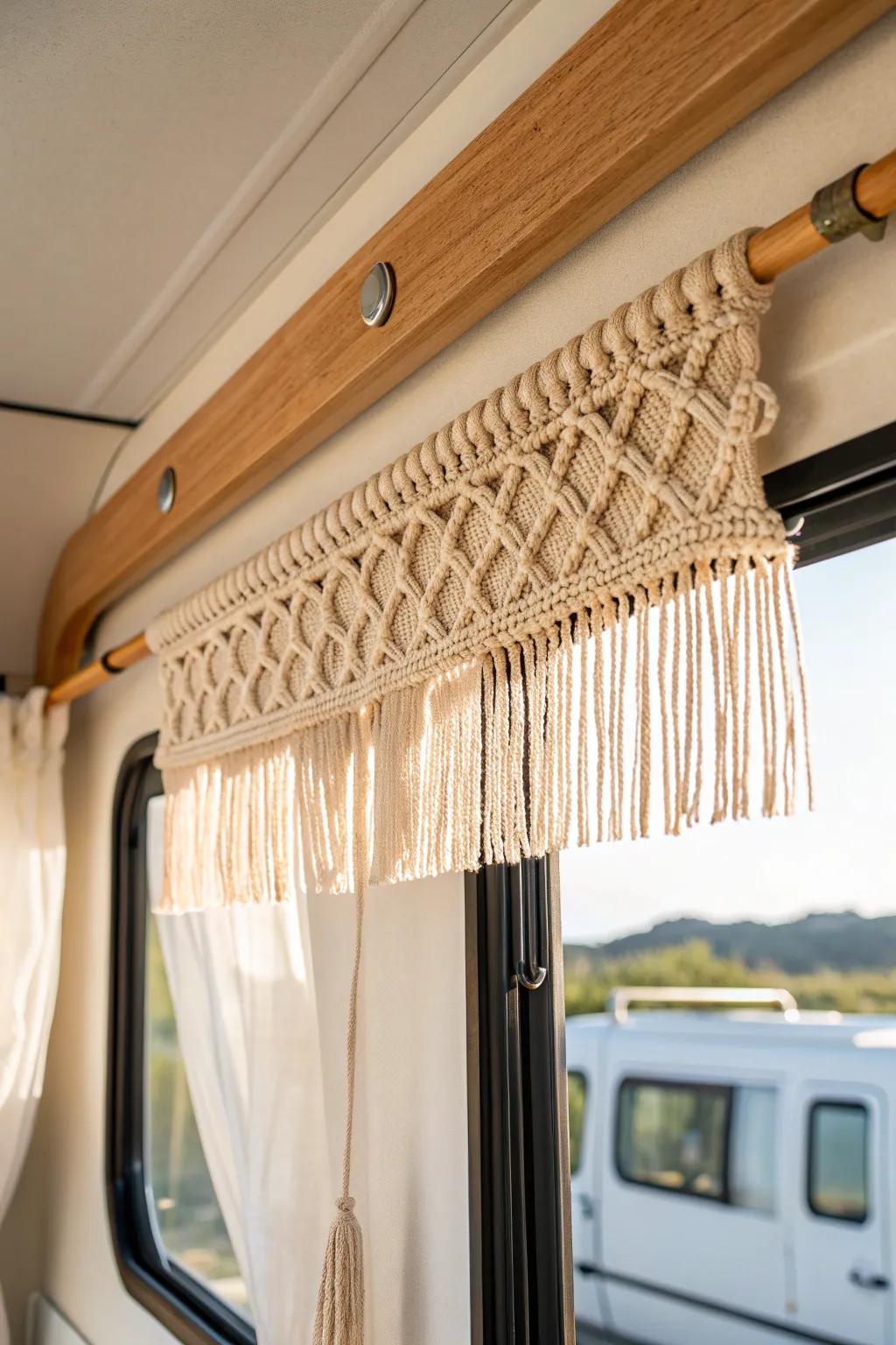 Handmade macrame window topper adds cozy texture and airy light to a small RV space.