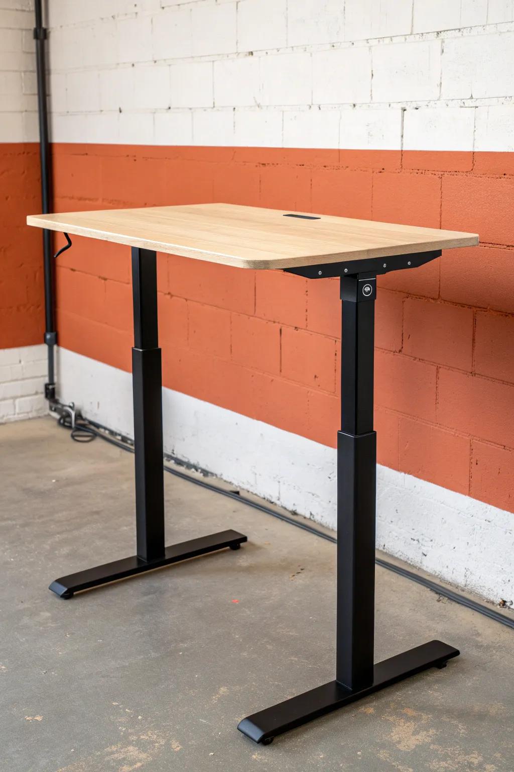 Compact sit-stand desk, slim footprint—natural birch + bold terracotta contrast for small spaces.