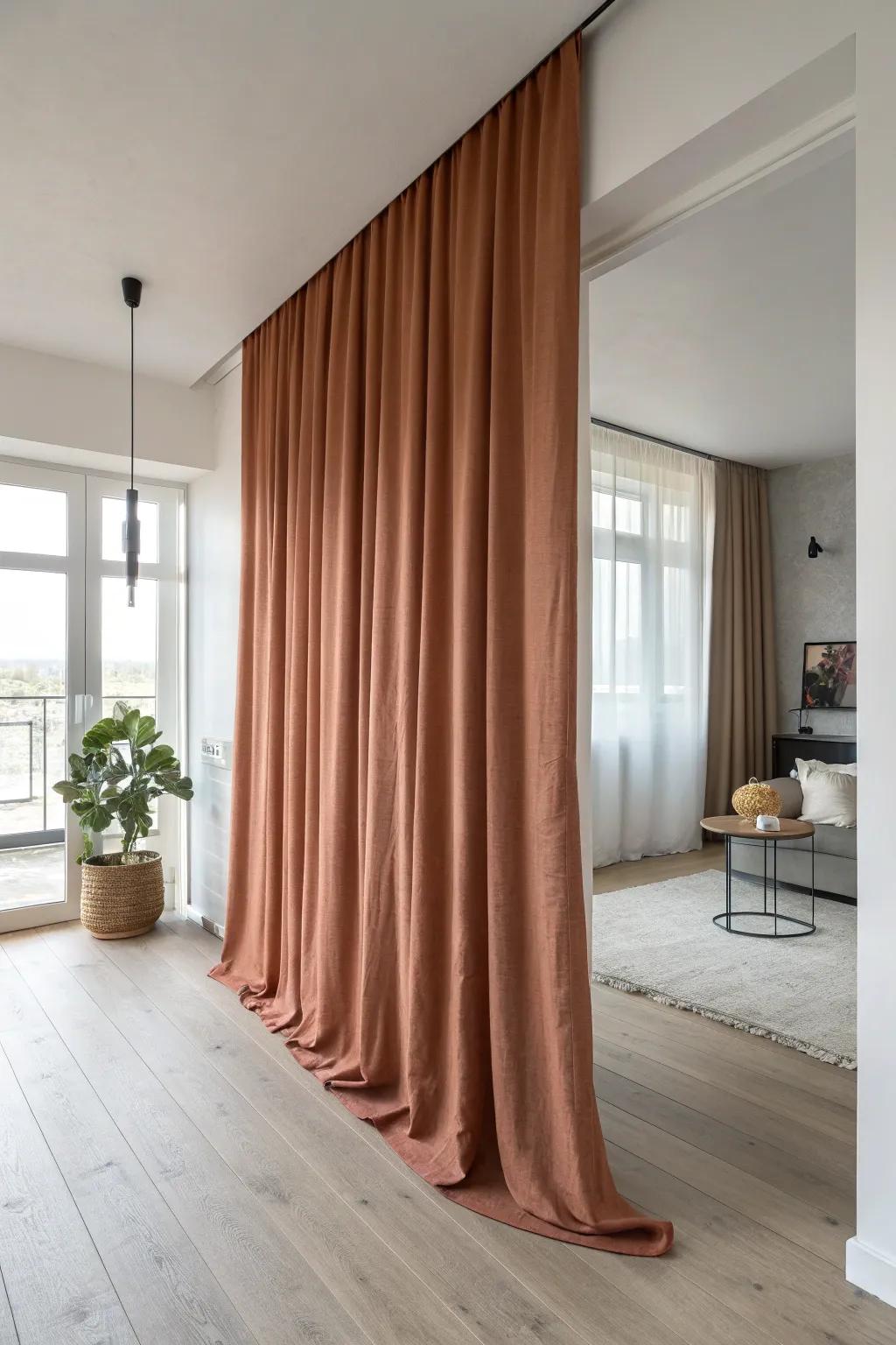 Ceiling-mounted curtains add privacy on demand—without closing in your small open floor plan.