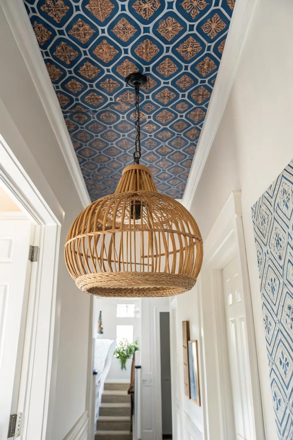 A bold statement ceiling and artisan pendant instantly make a narrow townhouse entry feel taller.