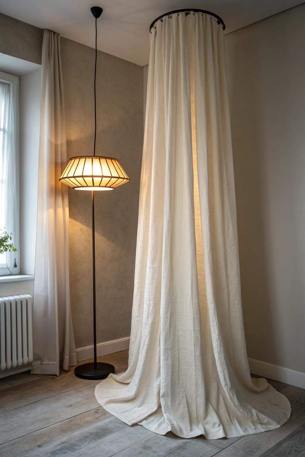 A ceiling-hung linen curtain creates a private, cocoon-like reading nook—no walls required.