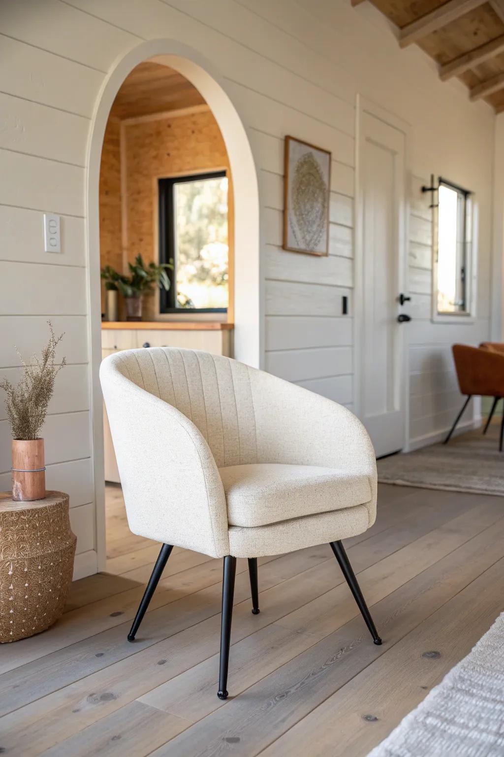 Soft painted arch + boucle chair = instant cozy zone in a single-wide mobile home.