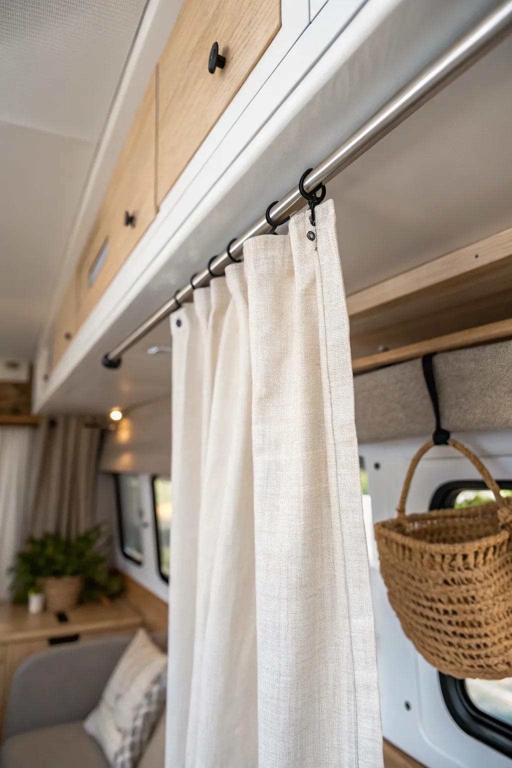 A simple ceiling curtain track instantly creates calm, flexible privacy in a tiny camper van.