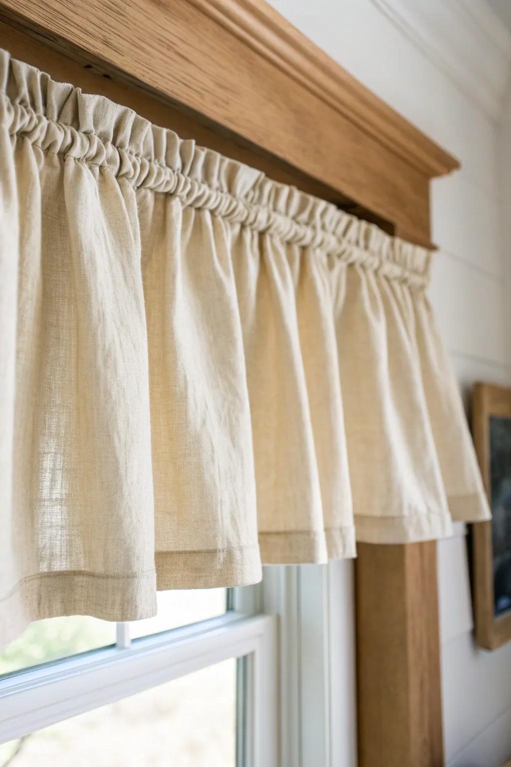 A soft linen valance hides the top clutter and keeps a small living room window looking polished.