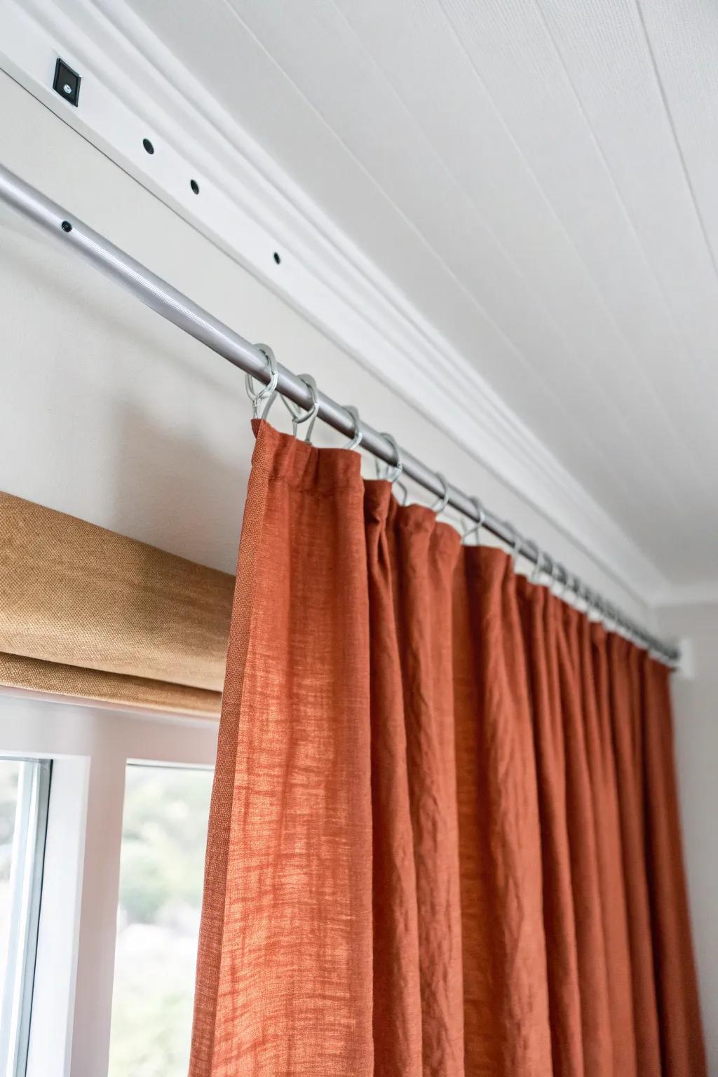 Ceiling-mounted curtains add instant privacy—high-impact style with low-commitment installation.