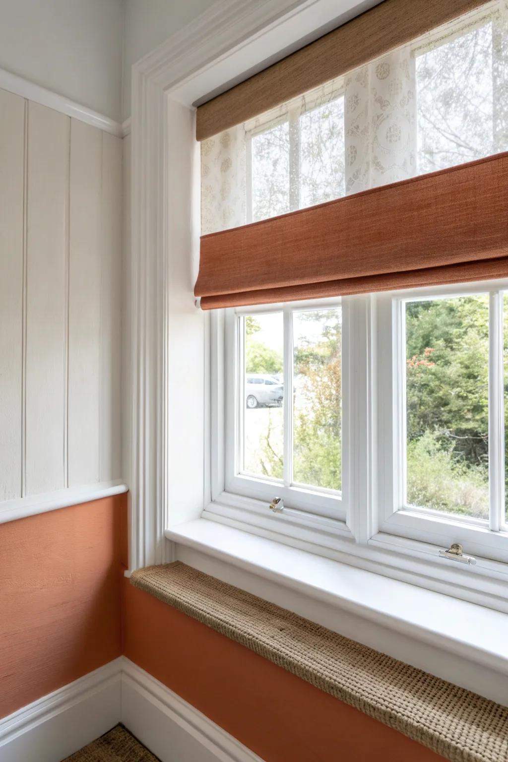 Two-tone paint band + light-filtering shade for bold bay window privacy without blocking light.