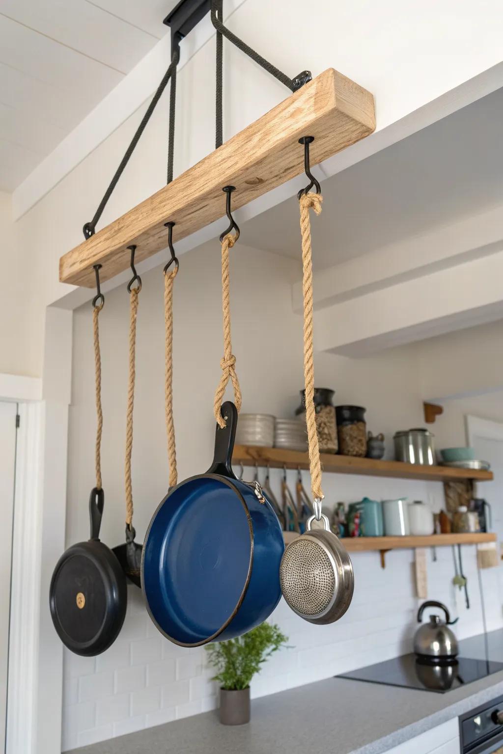 Pulley lift rack turns tall ceilings into storage—lower it to cook, raise it to declutter.