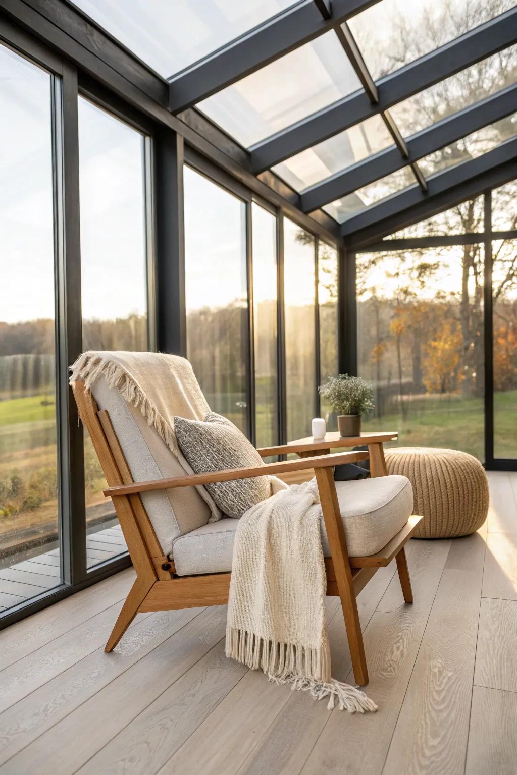 Minimal three-season glass sunroom vibe: one cozy chair for bright, chilly spring mornings.