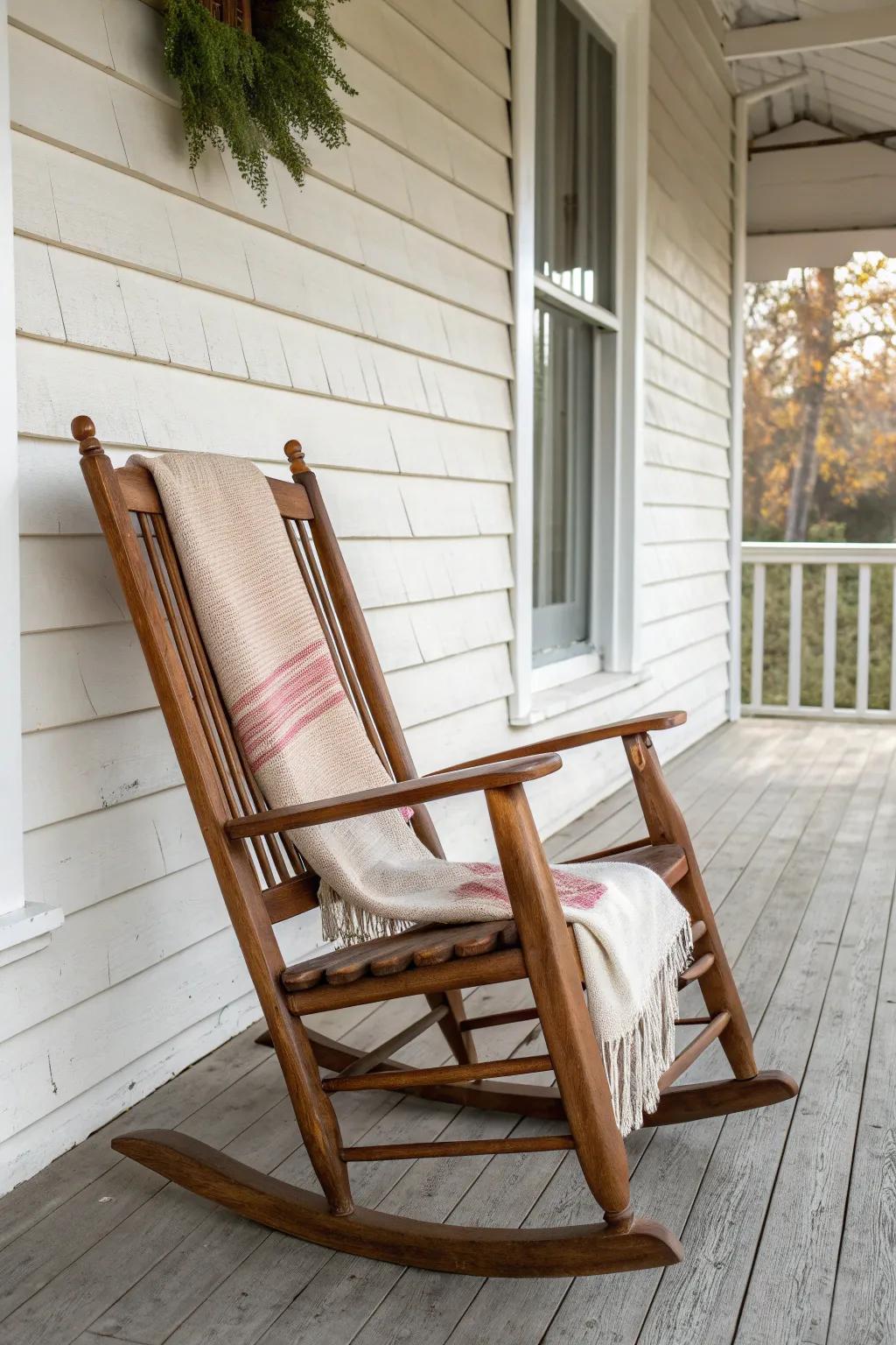 A slim classic rocking chair turns a tiny old porch into a cozy, conversational nook.