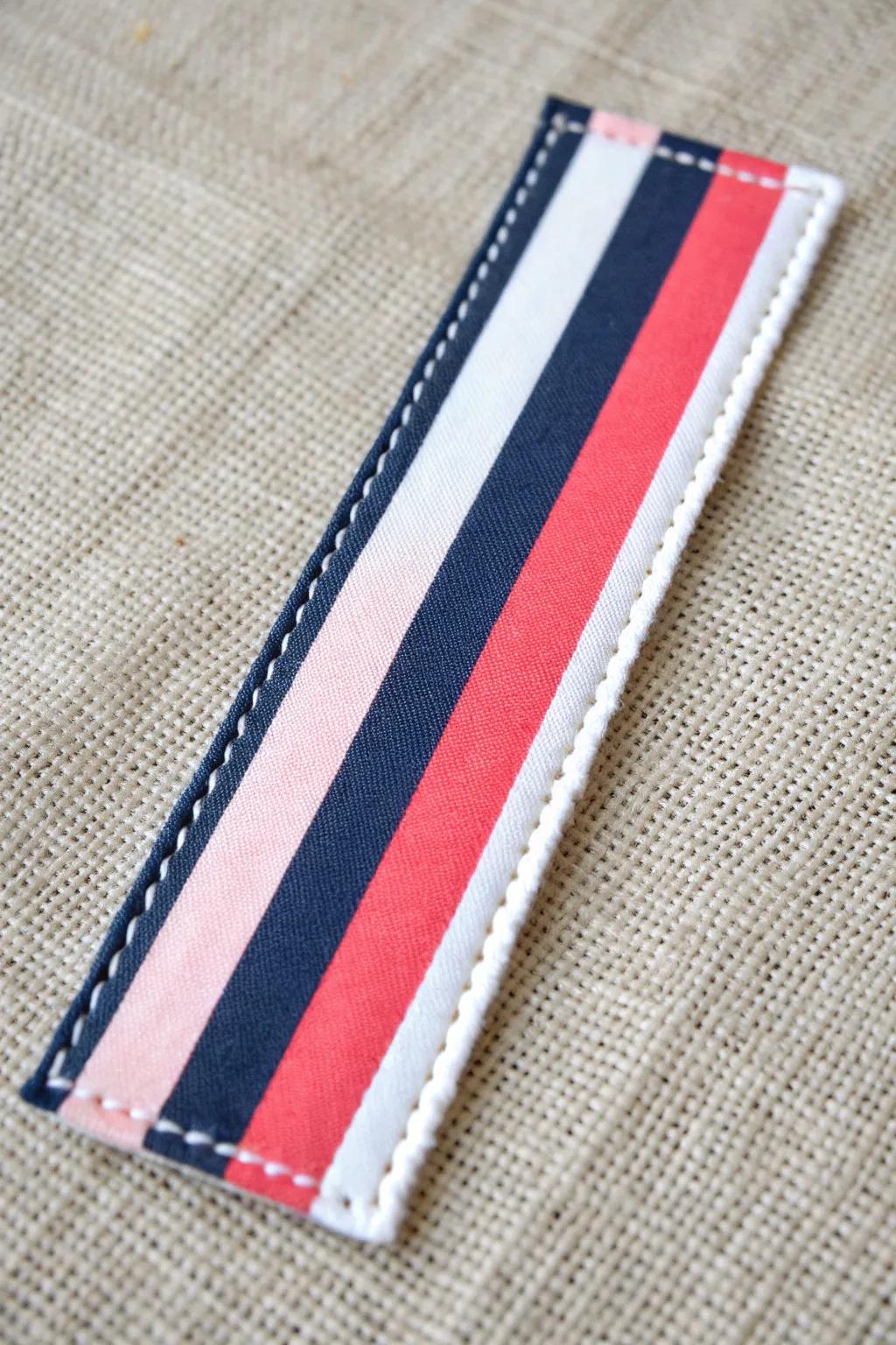 Stripe your way to elegance with this chic preppy bookmark!