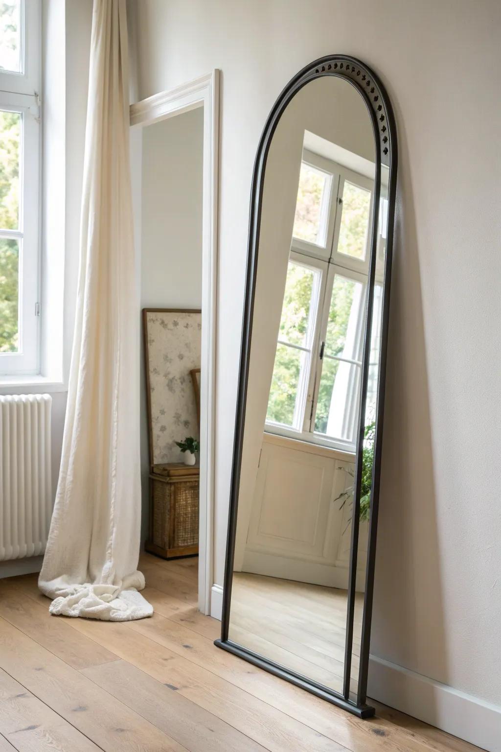 An arched hallway mirror instantly bounces light and makes a narrow entry feel wider.
