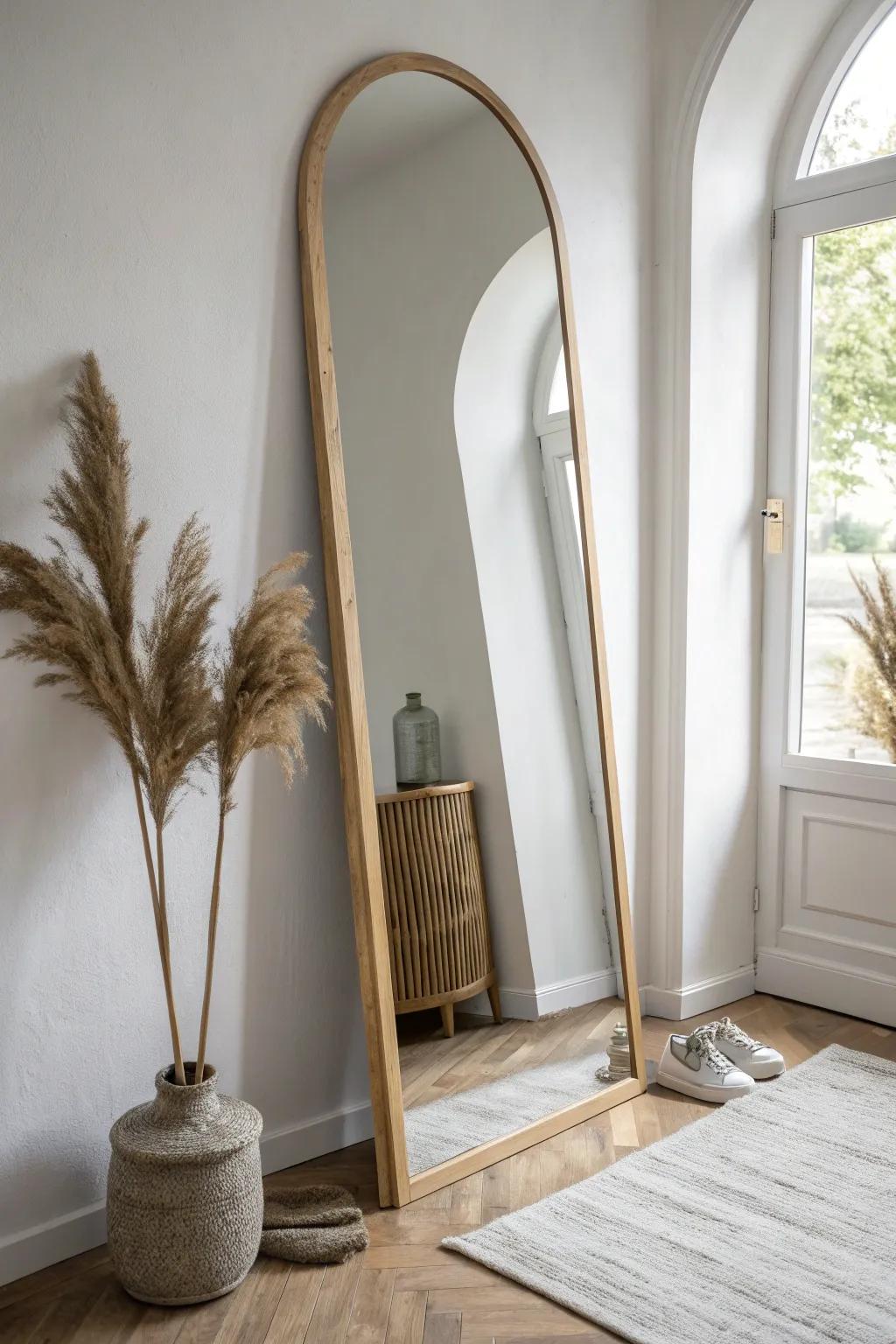 A tall, slim mirror that brightens a narrow entry and adds instant vertical statement.