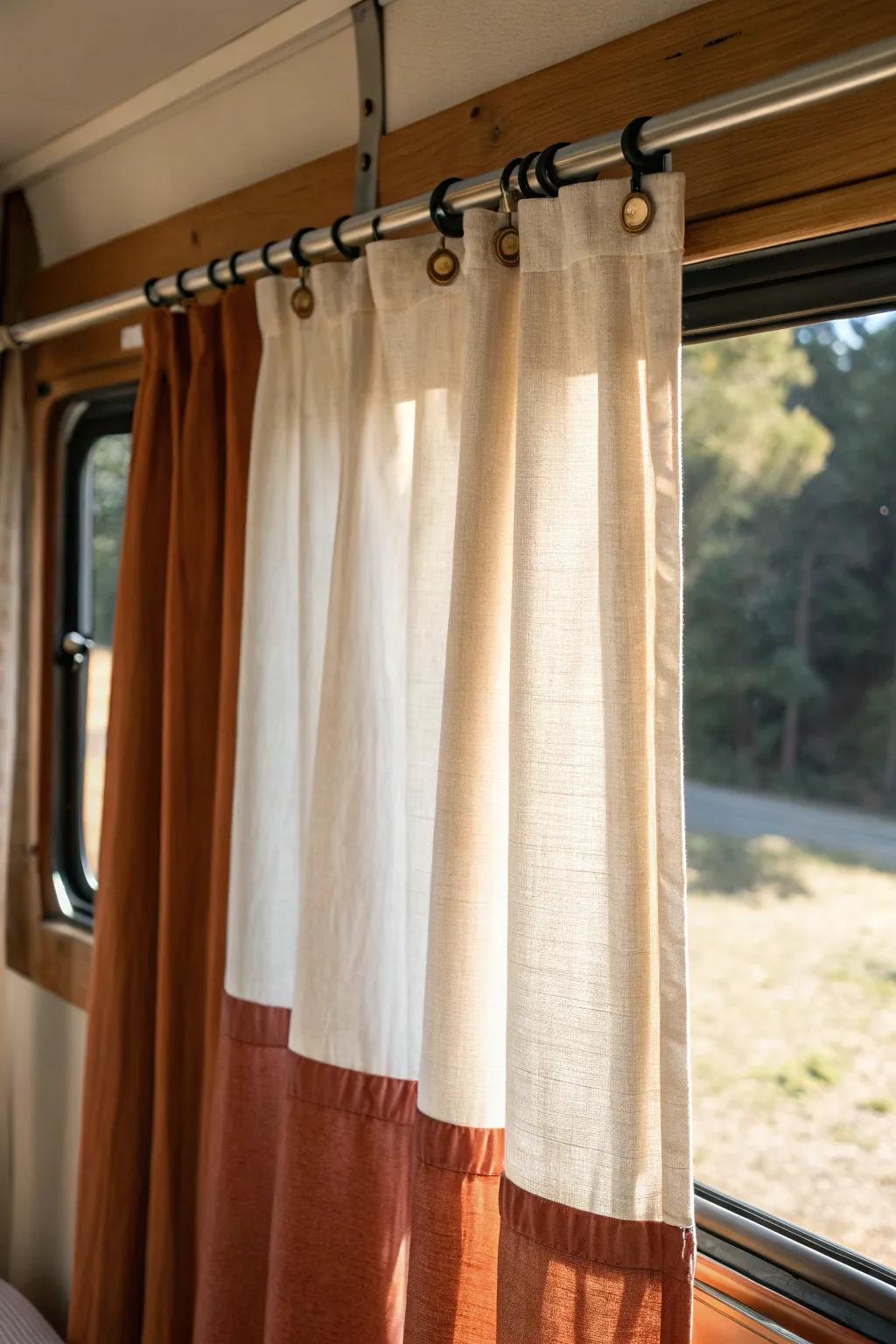 Two-tone color-block camper curtains: light up top, earthy base below for bold, tidy style.