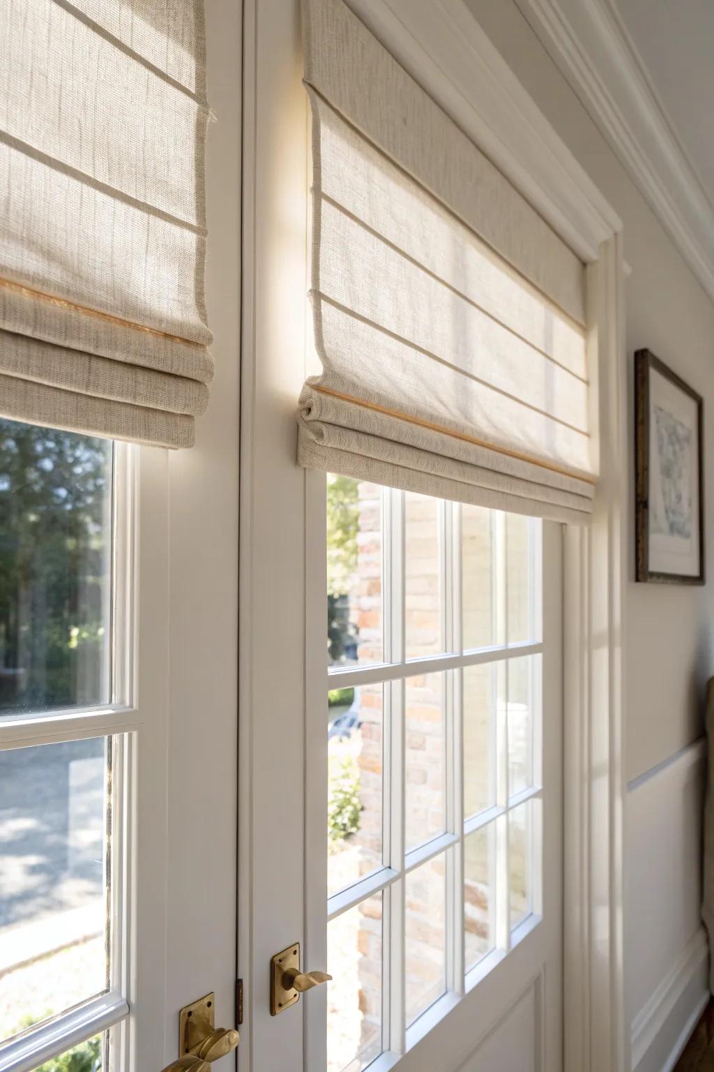 Soft linen Roman shade keeps door glass private—tailored look without taking an inch of space.