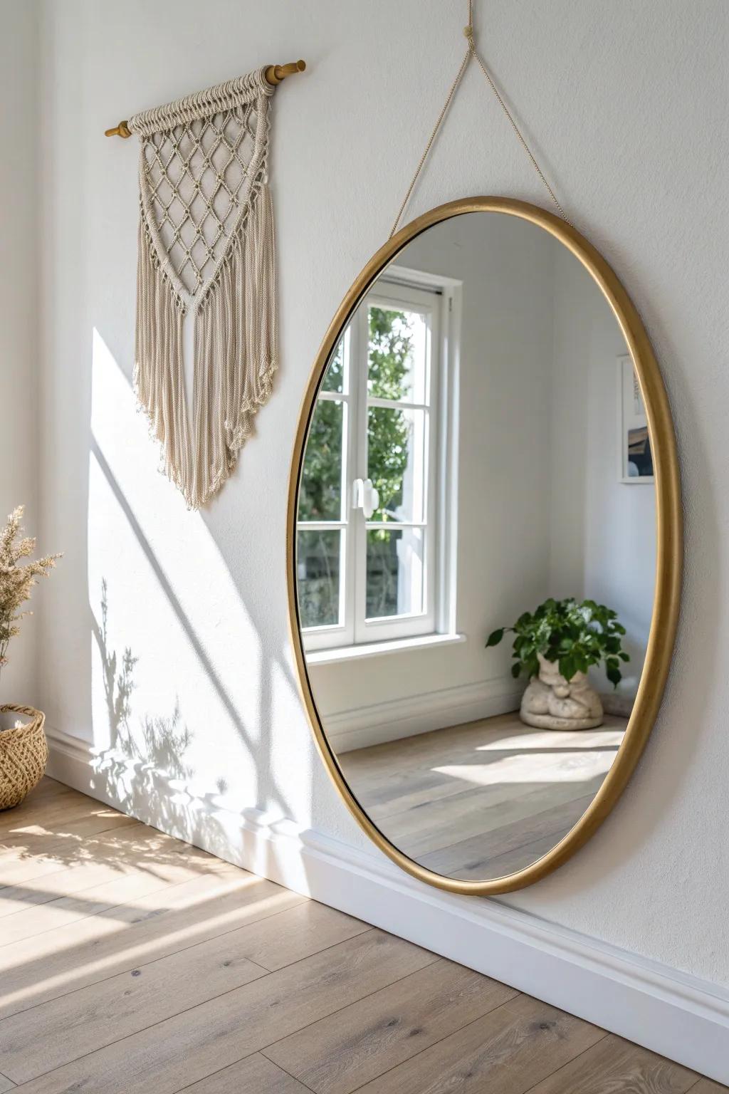 Hang one oversized mirror to bounce daylight and make a small entry feel twice as bright.