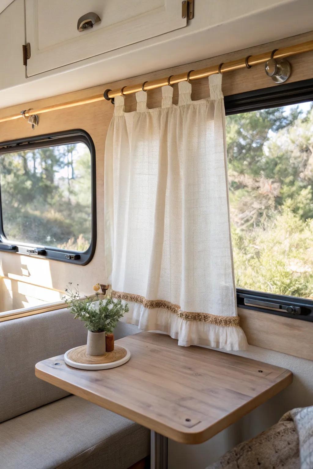 Tailored linen café curtains keep RV dinette privacy while letting in bright, airy light.