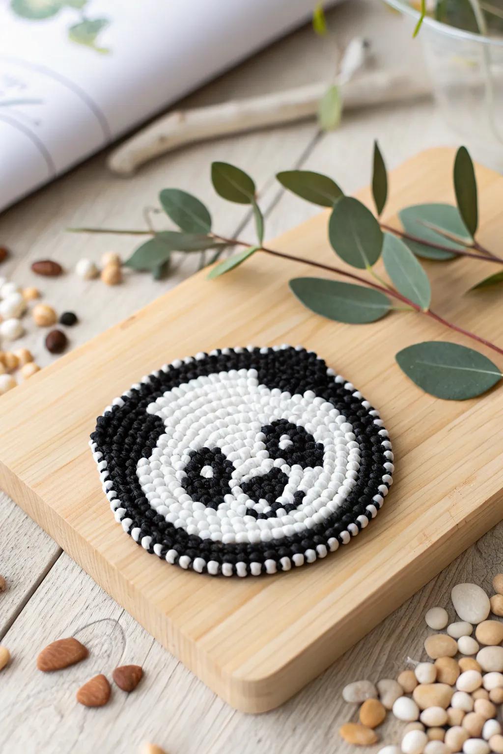 Add a touch of whimsy to your coffee table with this charming panda perler bead coaster, where minimalist design meets playful creativity.