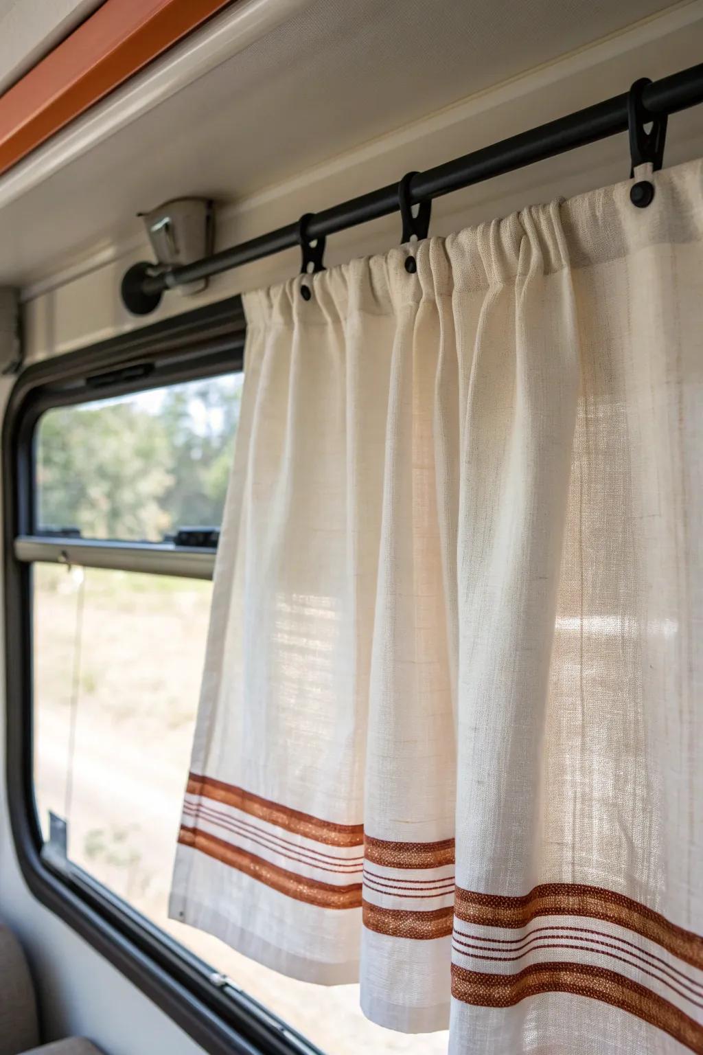 Swap chunky RV valances for airy linen curtains—instantly brighter windows and more height.