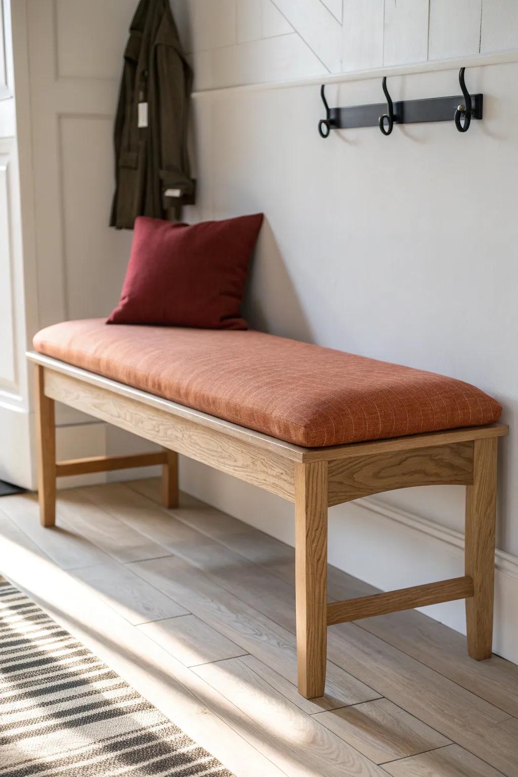 A slim backless bench + one cozy cushion = an inviting entryway that stays easy to pass.