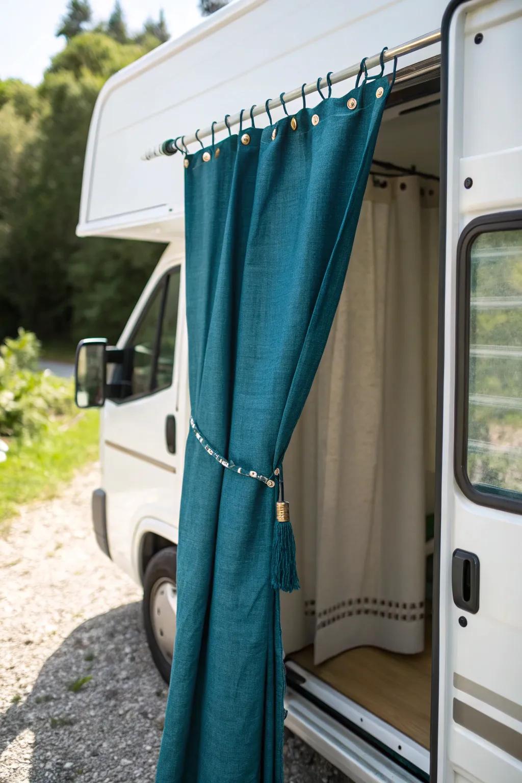 Deep teal linen privacy curtain turns rear van doors into a chic outdoor shower nook.